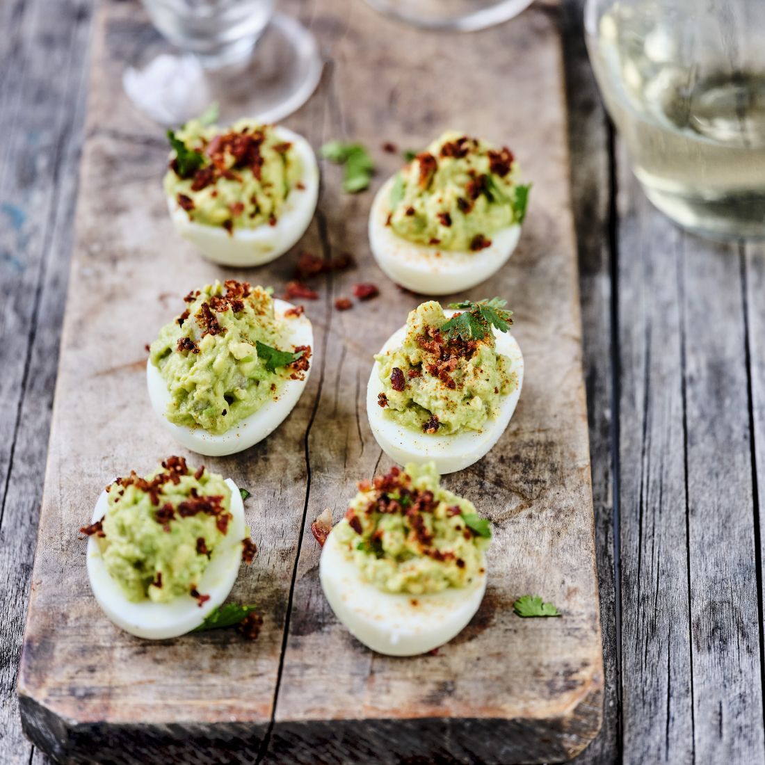 Mimosa Eggs with Guacamole & Bacon Crumbs